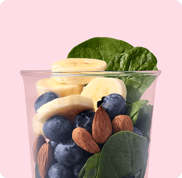 Banana slices, blueberries, almonds, and spinach