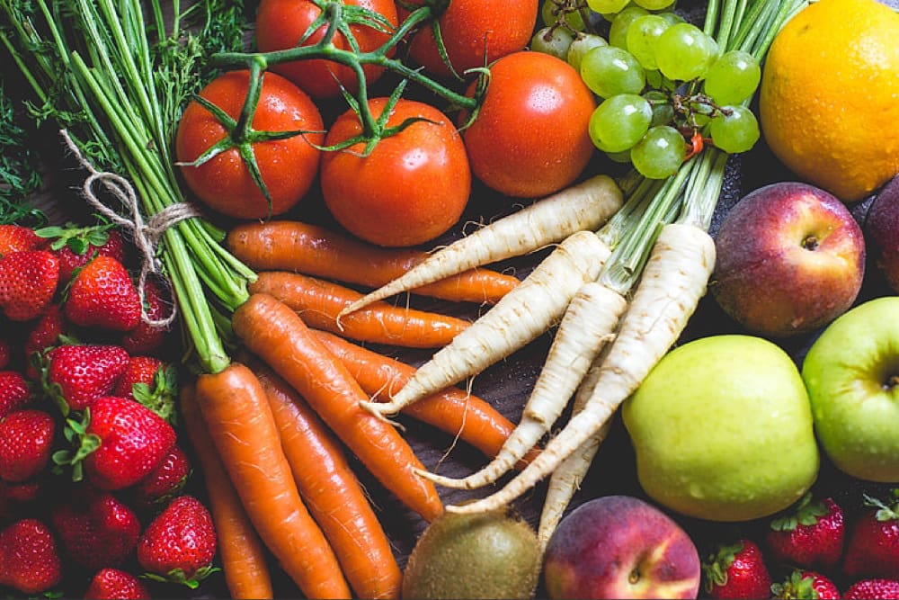 Various fruits and vegetables displayed on a table