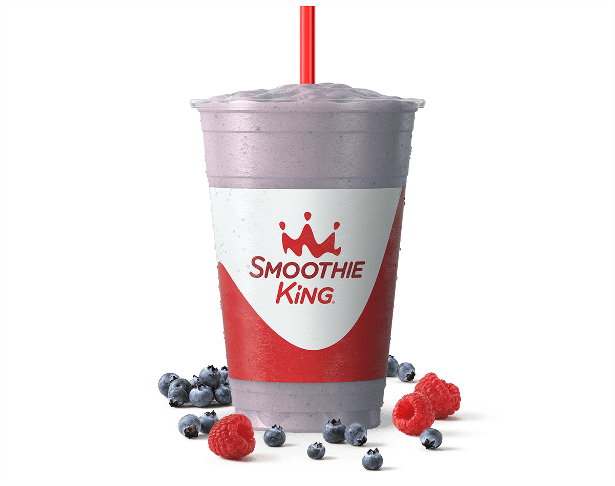 Purple smoothie from Smoothie King with real fruit beside it