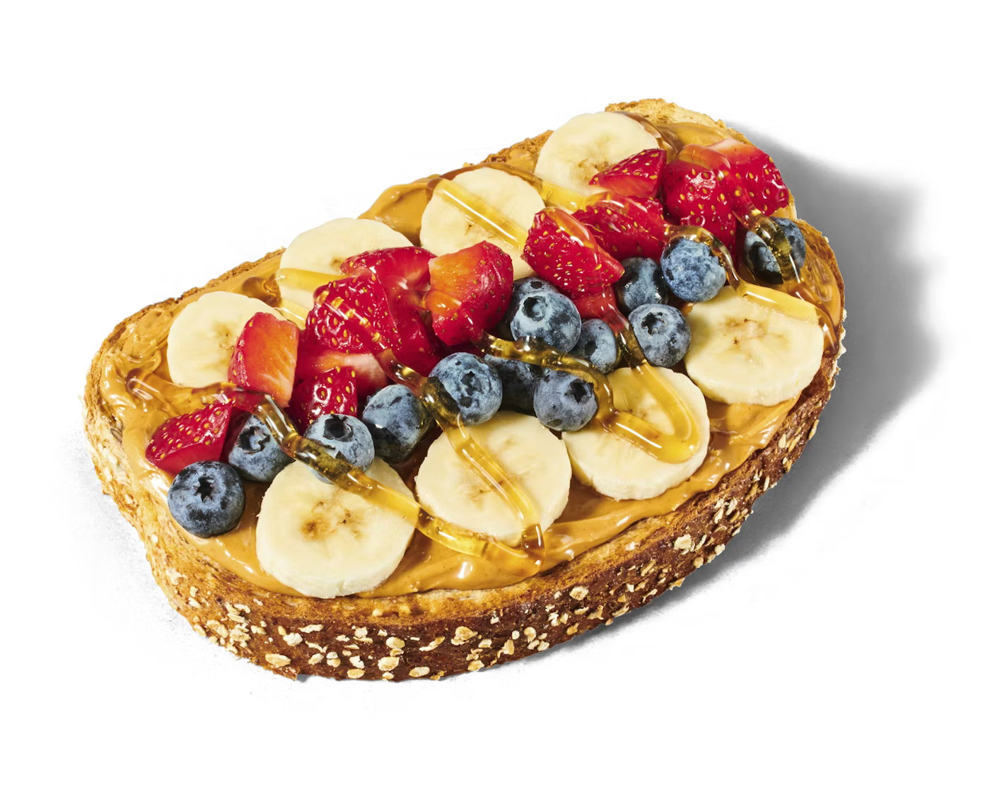 Loaded toast with peanut butter, fruit, and honey