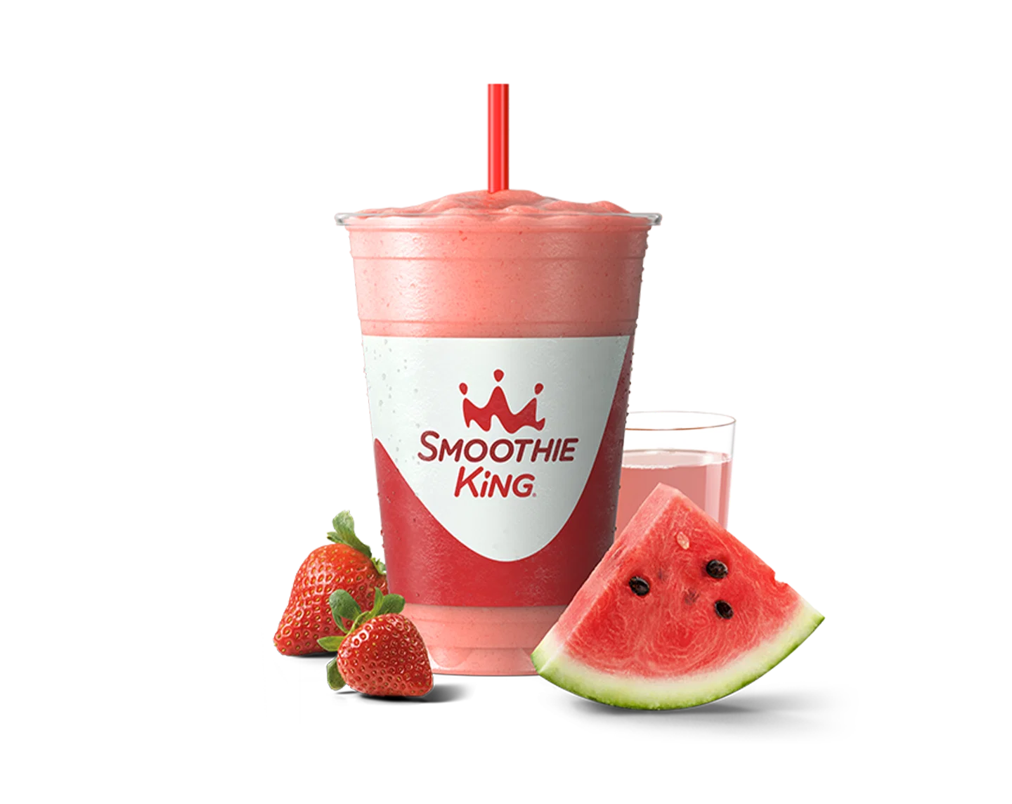 A healthy smoothie with strawberries and a slice of watermelon sitting beside it